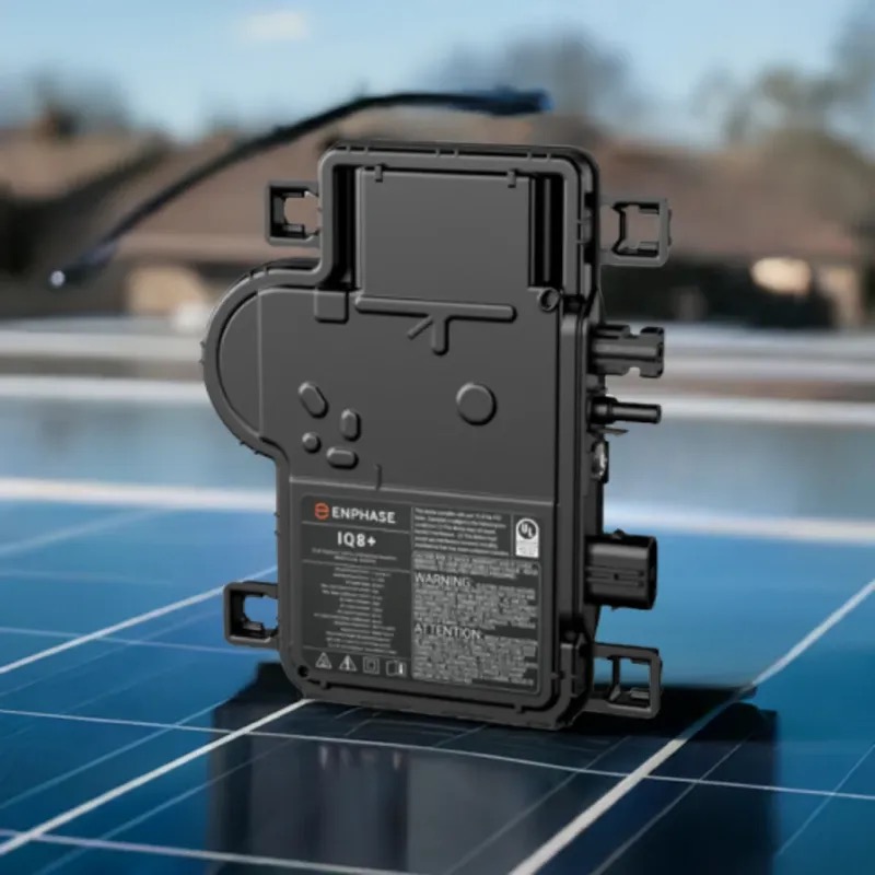 Enphase IQ8 microinverter mounted behind a solar panel