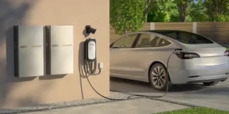 Illustration of wall-mounted home batteries beside an EV charging in a driveway
