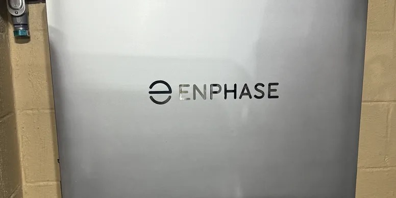 Wall-mounted Enphase home battery storage unit installed indoors