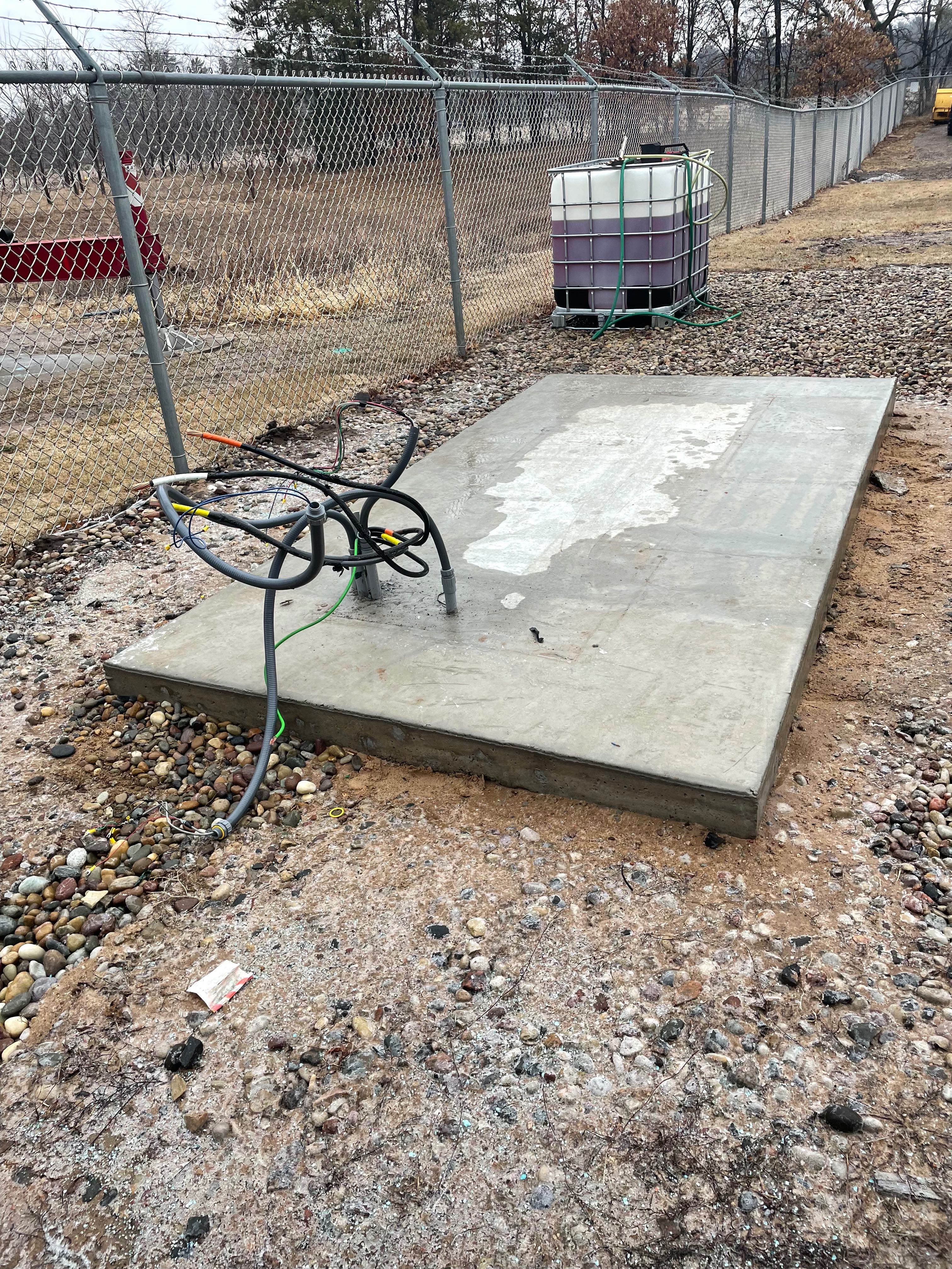 Concrete generator pad with electrical conduit and wiring roughed in